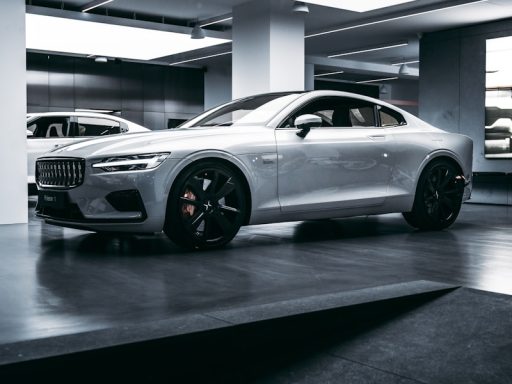 silver bmw m 3 coupe parked in building